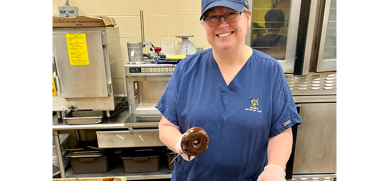Kitchen Staff with a donut