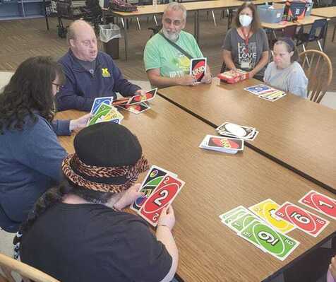 Participants playing giant Uno card game