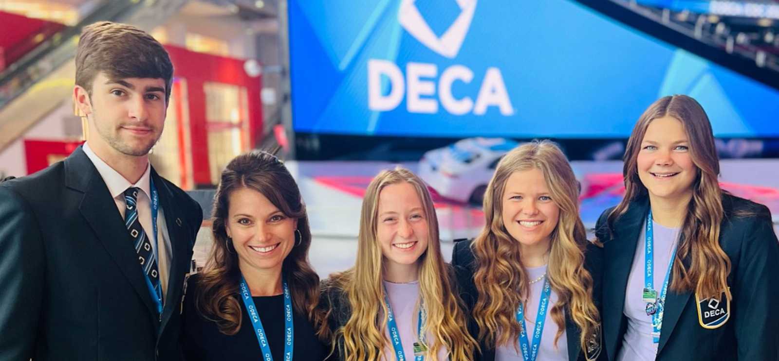 Staff with DECA Students