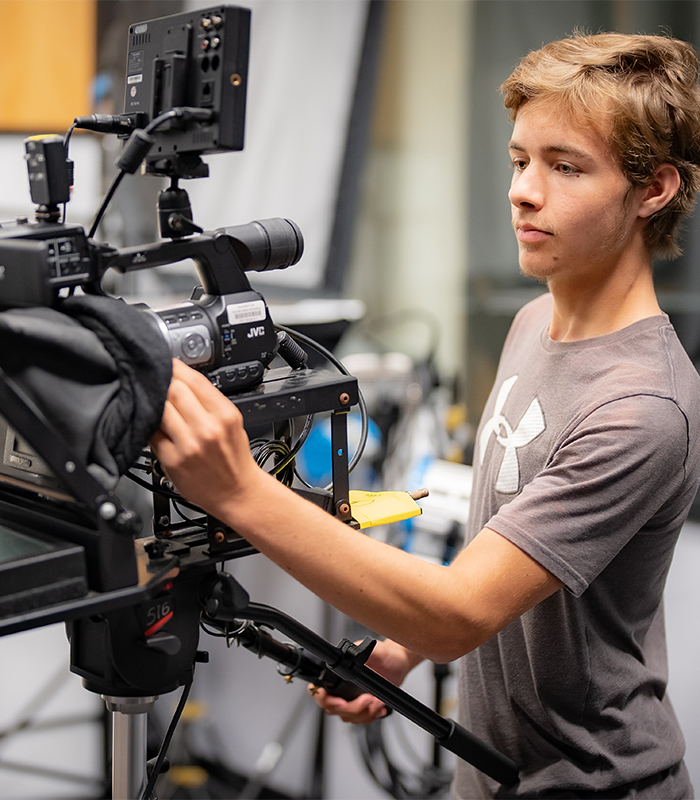 A Video News Production student operating a camera